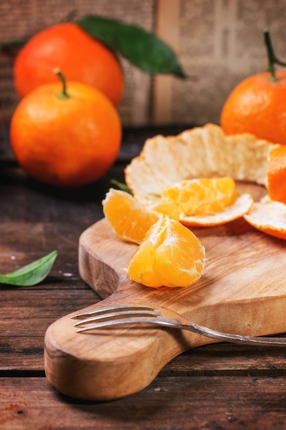 Tangerines on cutting board