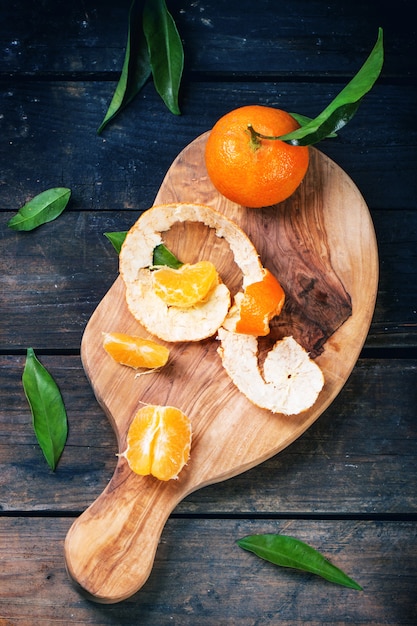 Tangerines on cutting board