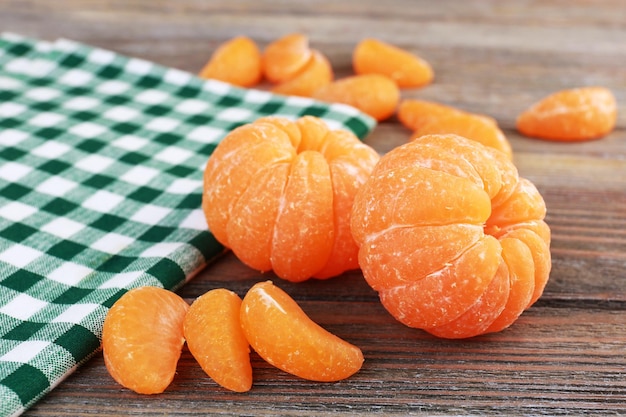 Tangerines on napkin on table