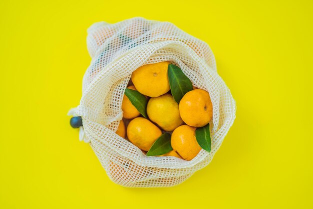 Tangerines in a reusable bag Zero waste concept