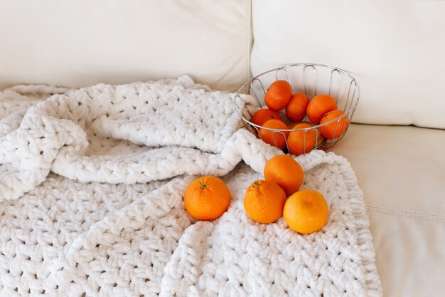 Tangerines on a white blanket in the New Year