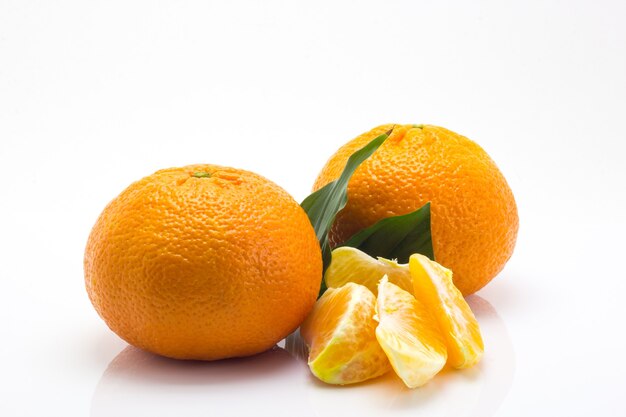 Tangerines with leaves on a white background