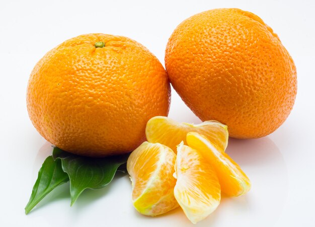 Tangerines with leaves on a white background