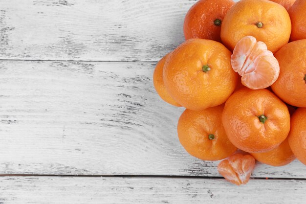 Tangerines on wooden background