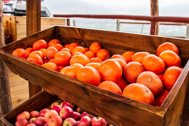 Tangerines in a wooden basket in a market