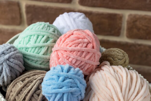 Tangles of plush yarn Basket with knitting threads Plush yarn