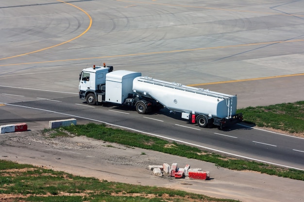 Photo tank truck aircraft refueler moves on the airport apron