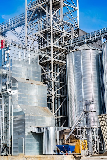 Tanks of different size and shape at factory. Industry of harvest storage.