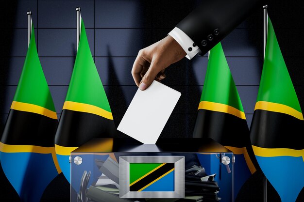 Foto bandiere della tanzania che fanno cadere a mano la scheda elettorale in un'illustrazione 3d del concetto elettorale di voto della scatola