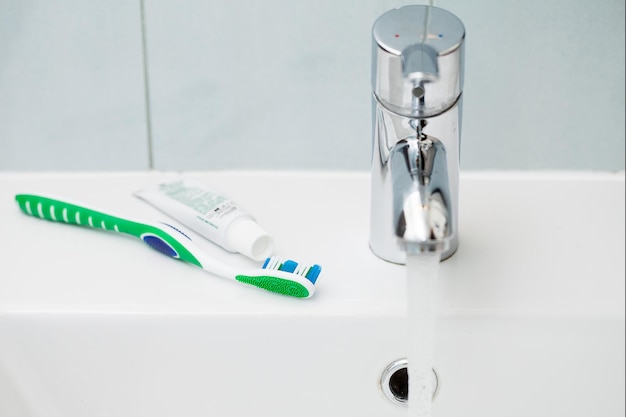 Tap and toothbrush over the sink