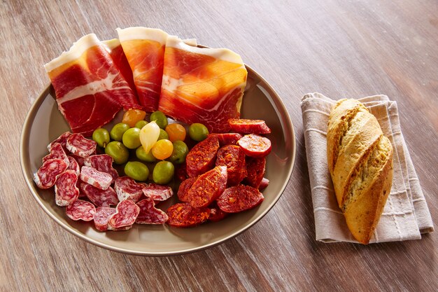 Tapas of Spain with ham bread olives sausages