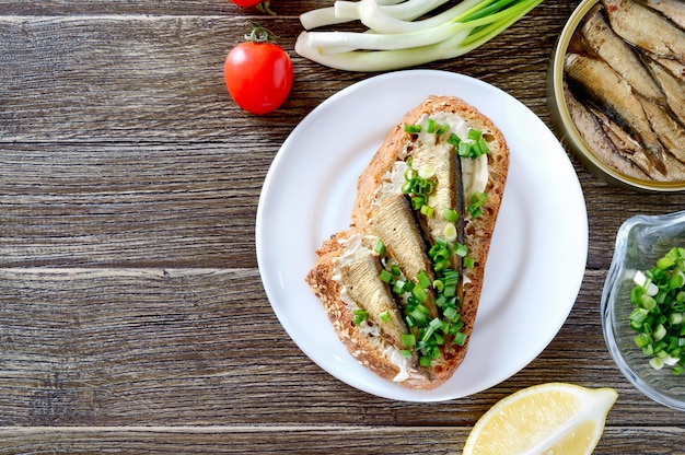 Tapas with sprats. Spanish traditional appetizer. Top view, overhead, flat lay