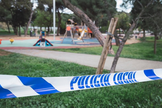 Tape against trees at park