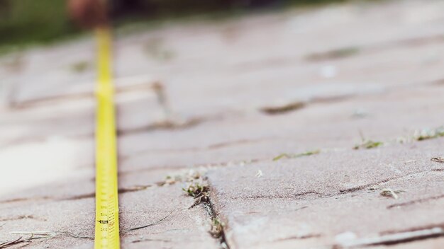 Photo tape measure road. men's hands hold a measuring tape. construction, engineering, repair concept