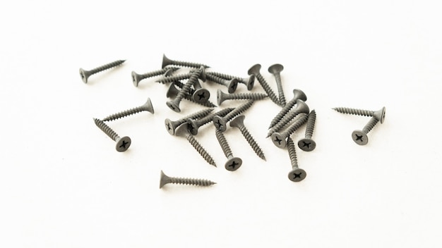 Tapping screws made of steel, metal screw, iron screw, chrome screw, screws as a background, wood screw