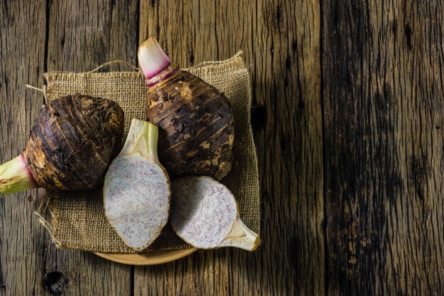 Taro dish on the table in the old wood.