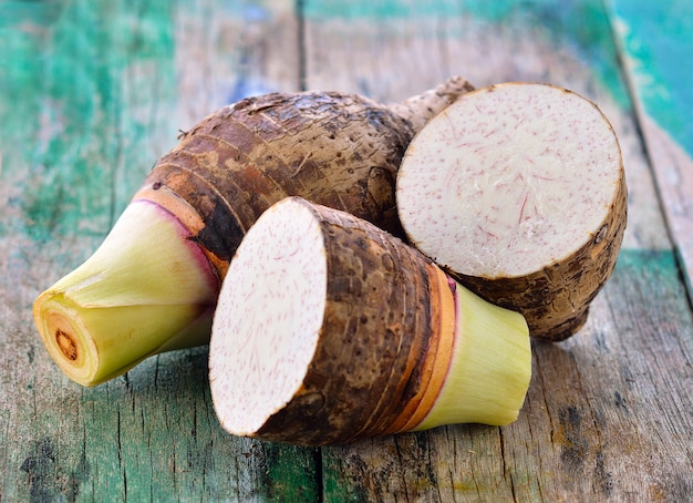 Taro root on wooden