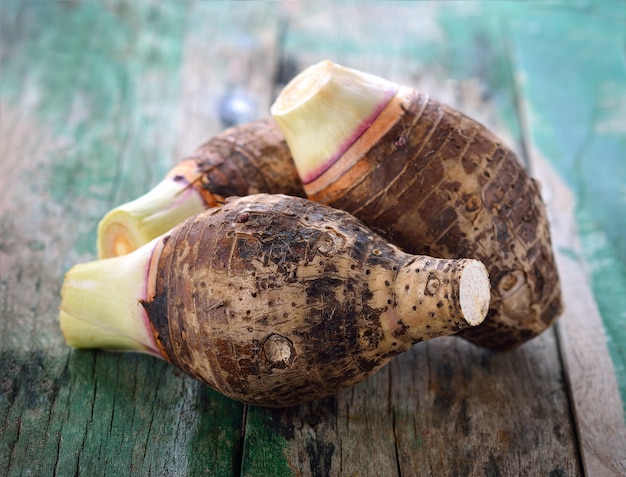 Taro root on wooden