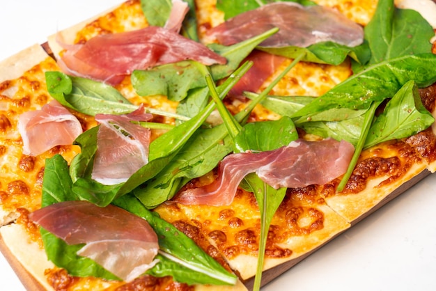 Tart flambe parma ham and rocket pizza