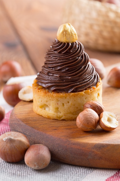 Tart with chocolate cream and golden nut on top