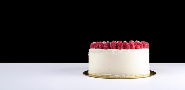 Photo tart with fresh raspberries and mint studio shot over black and white background