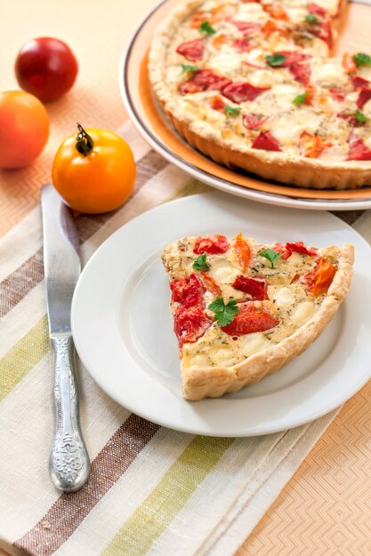 Tart with salted sheep cheese and tomatoes