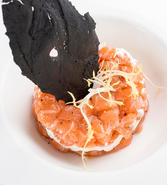 Tartar with salmon on white background