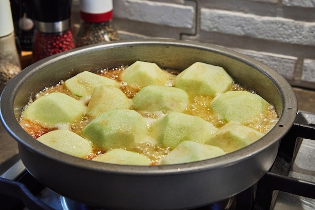 Tarte tatin French apple pie in skillet on gas stove