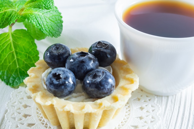 Tartlet or cake with fresh blueberries and cream cheese