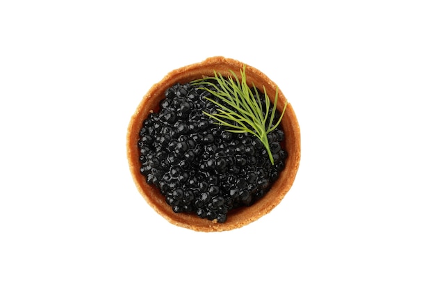 Tartlet with black caviar and dill isolated on white