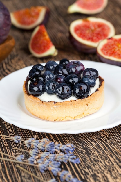 Tartlet with cream and blueberries, tartlet with blueberries , cream and ripe figs