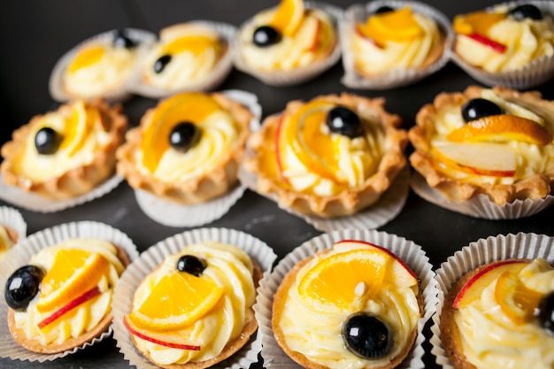 Tartlets with cream lemon and olive Close up photo