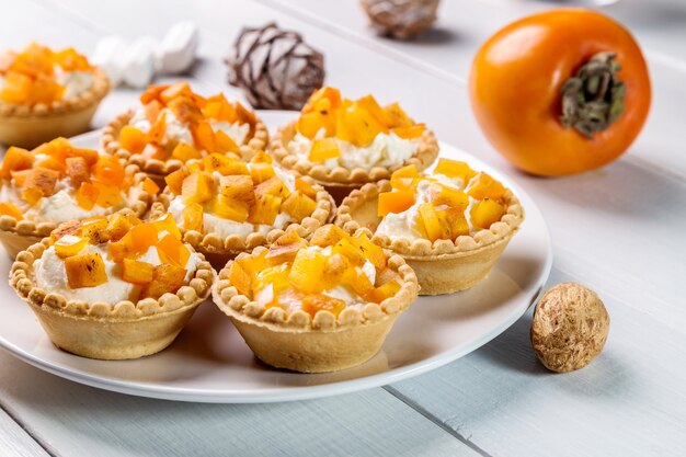 Tartlets with curd cream and persimmon