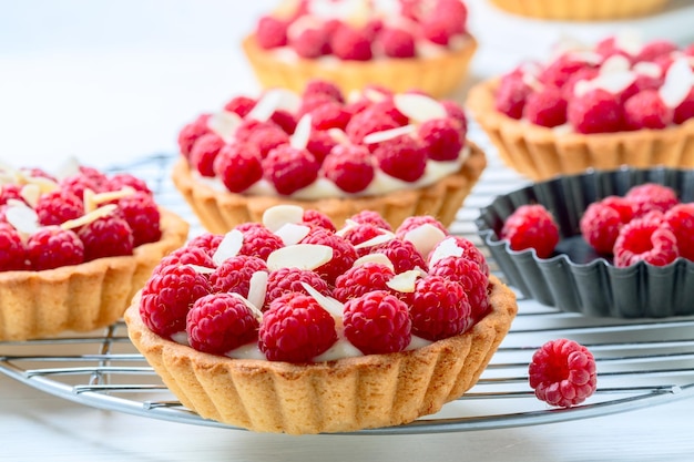 Tartlets with custard and raspberries