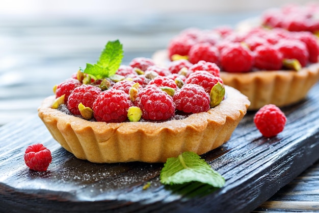 Tartlets with fresh raspberries and pistachios