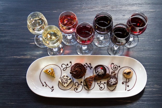 Tasting of wine and pattie chocolate pastries.