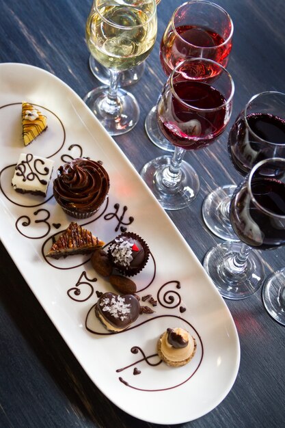 Photo tasting of wine and pattie chocolate pastries.