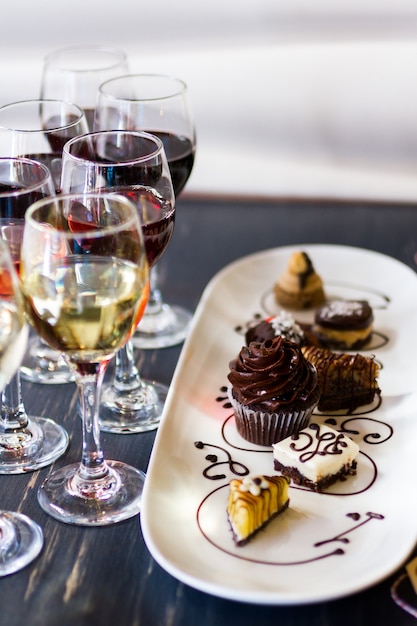 Photo tasting of wine and pattie chocolate pastries.