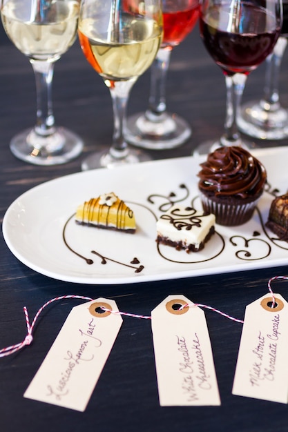 Photo tasting of wine and pattie chocolate pastries.