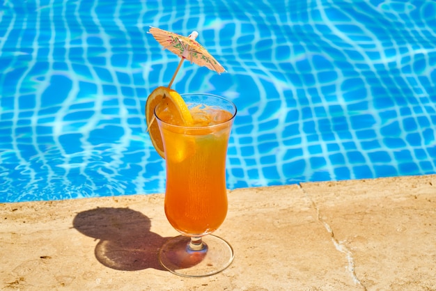 Tasty alcoholic beverage and pool view