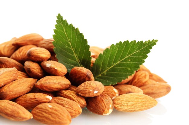 tasty almonds nuts with leaves isolated on white