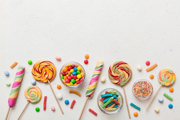 tasty appetizing party accessories happy birthday sweet different types of candies on colored background copy space colorful birthday party background