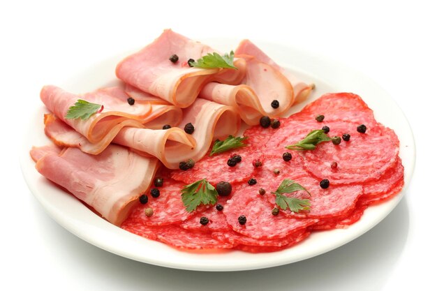 Tasty bacon and sausage with spices on plate isolated on white