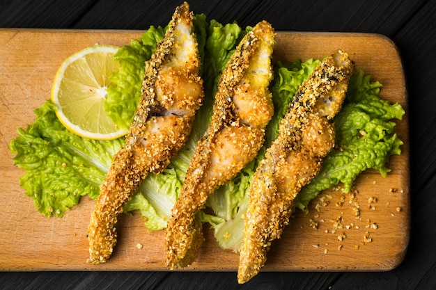 Tasty baked fish on plate table close-up