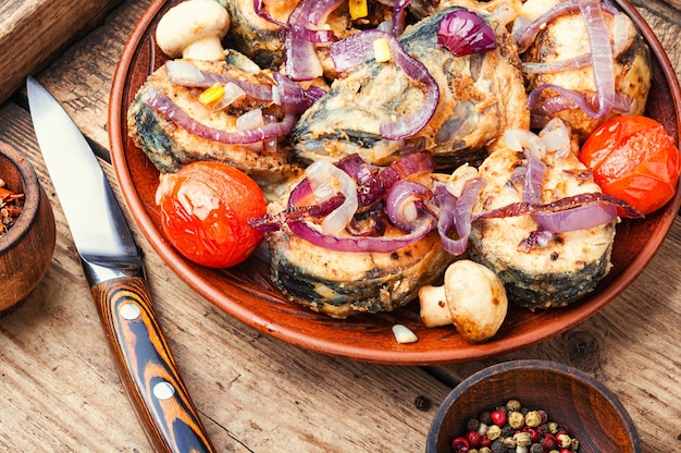 Tasty baked fish on plate