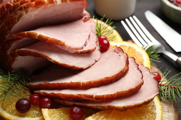 tasty baked ham served on black table closeup