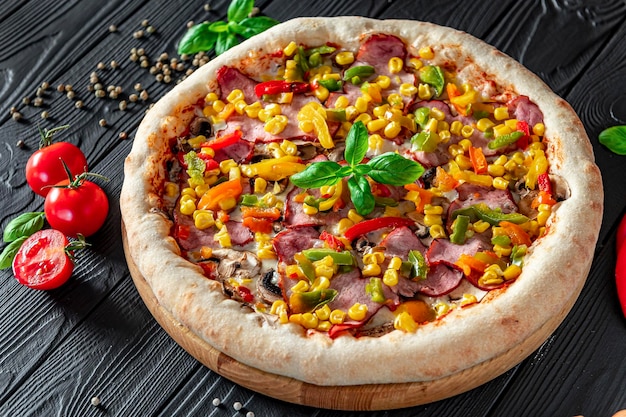 Tasty and big pizza with different types of meat Pizza with different types of ingredients sweet paprika and mushrooms