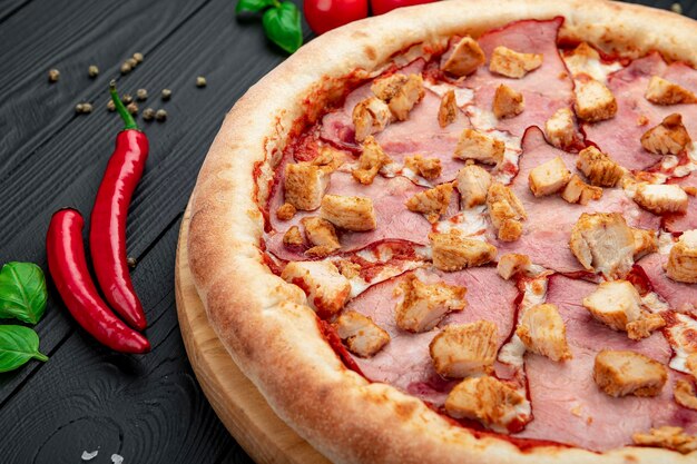 Tasty and big pizza with different types of meat