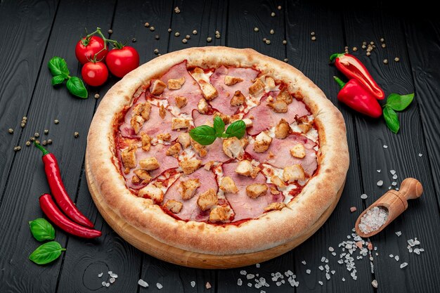 Tasty and big pizza with different types of meat