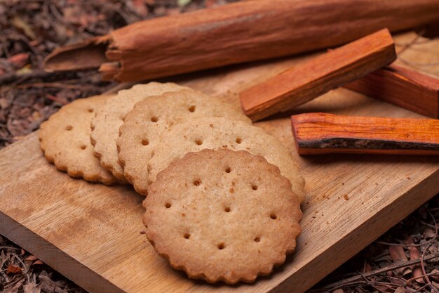 Tasty biscuits cookies on wooden cutting board